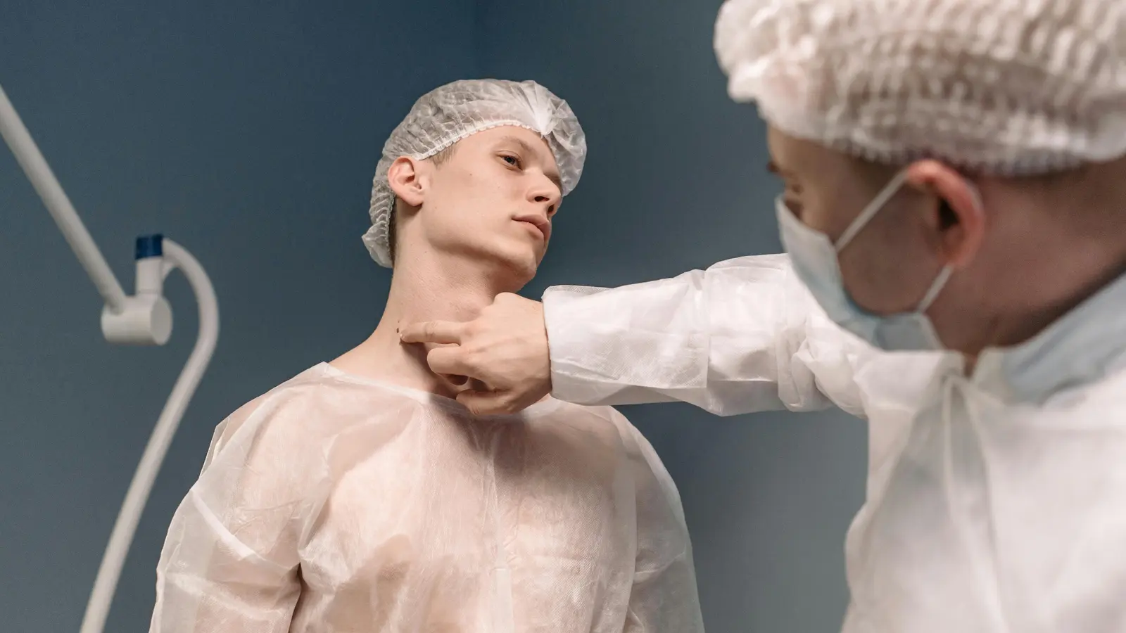 Surgeon examining patient representing FMLA medical leave
