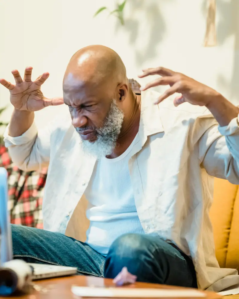 Person frustrated by ongoing neighbour dispute researching legal options in the UK