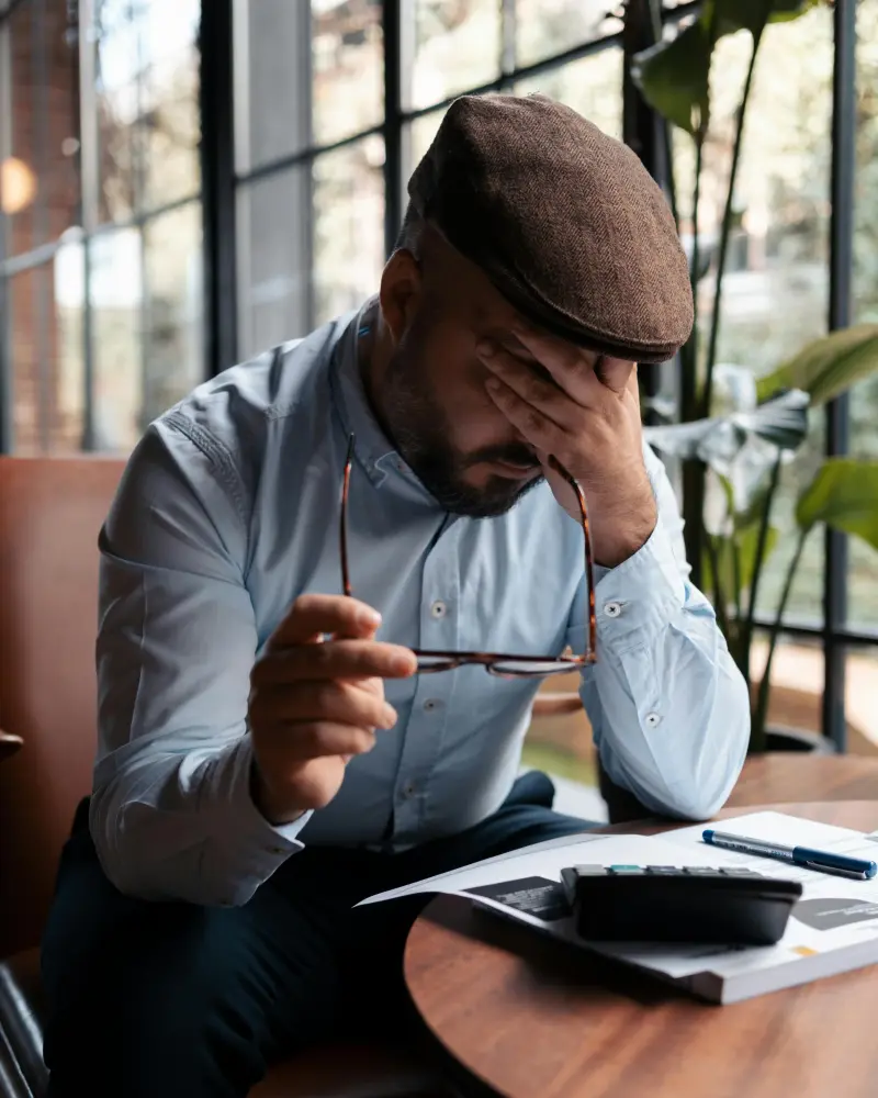 Person reviewing benefits documentation at a cafe in the UK