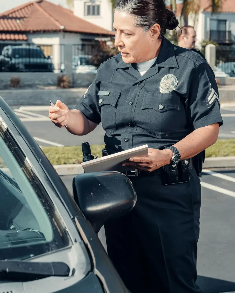 Police officer writing a ticket representing penalty points in Ireland