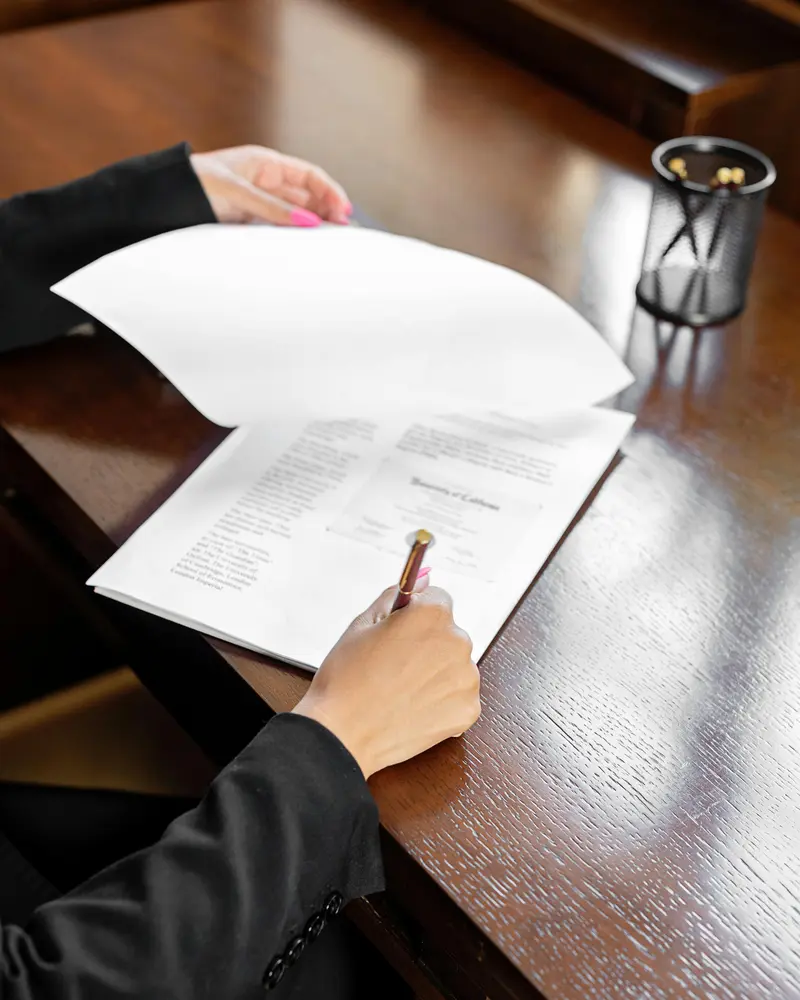 Person signing legal separation documents in England